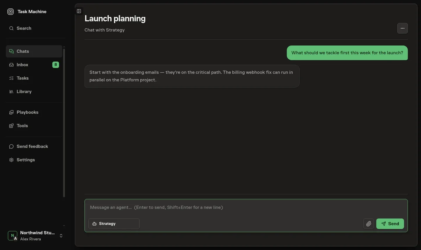A Chat with the Strategy agent, showing a short launch-planning exchange and the compact composer with Strategy selected