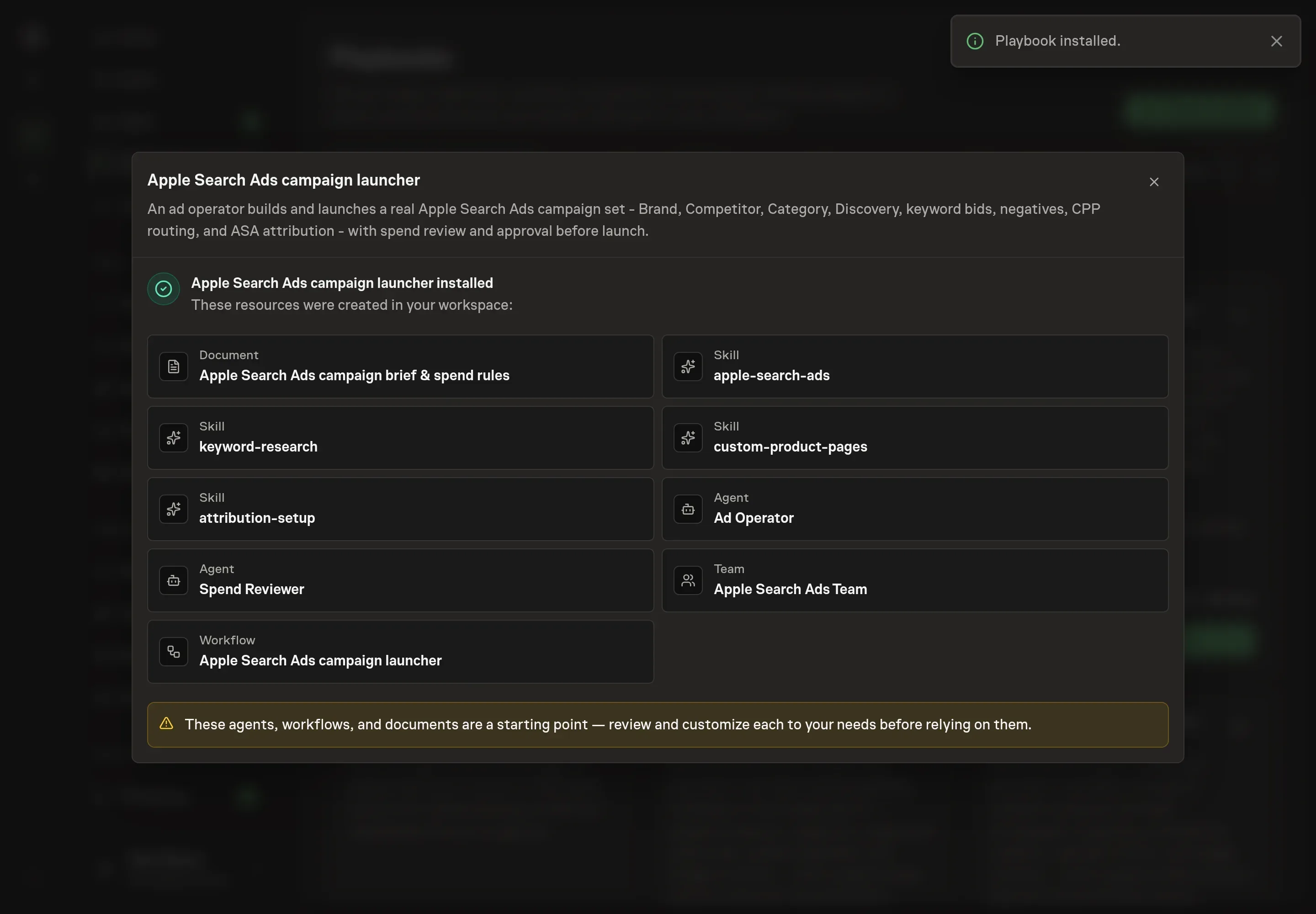 The install confirmation listing the created agents, team, skills, campaign brief document, and workflow, with a Playbook installed notice