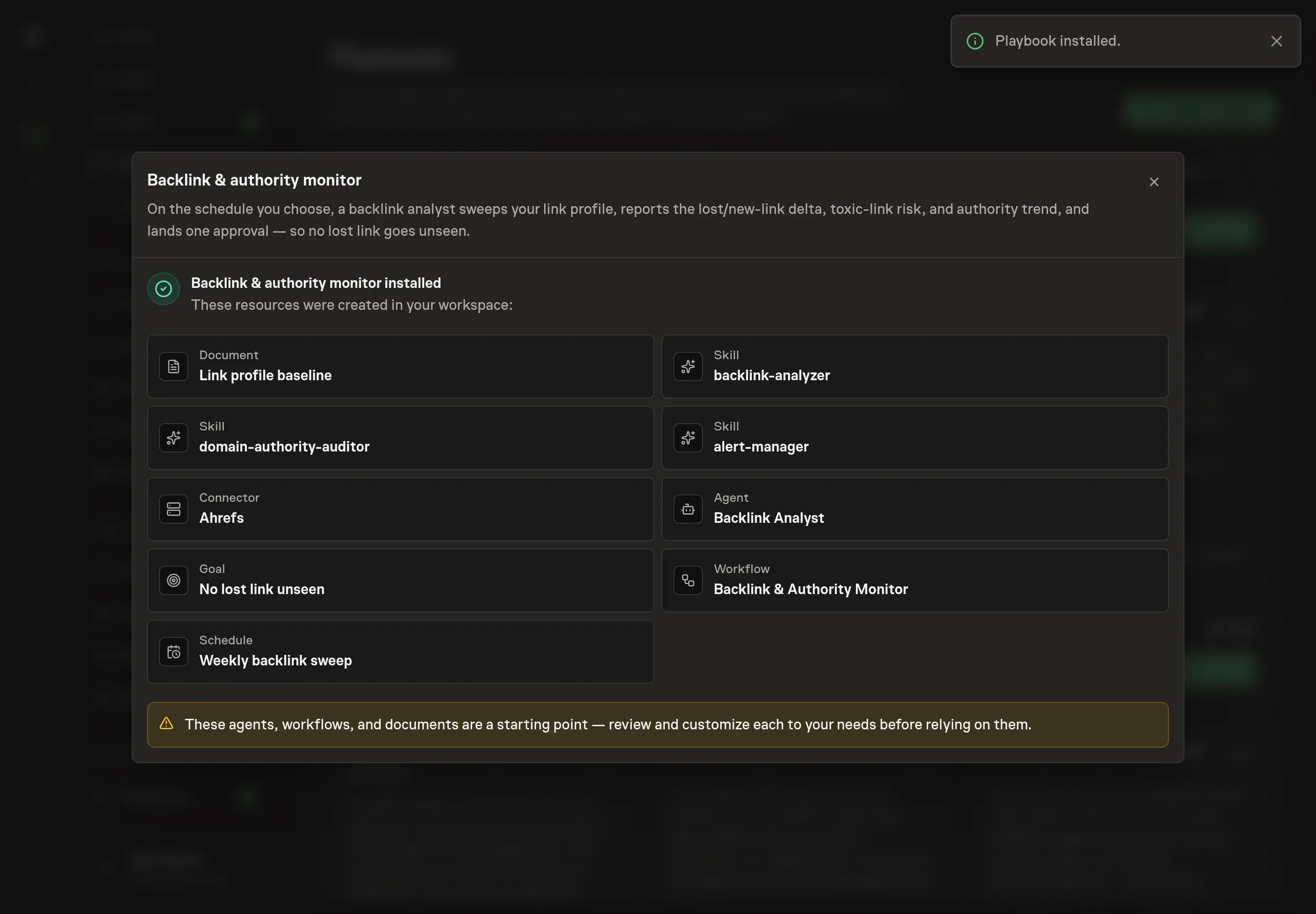 The install confirmation listing the created baseline document, all three skills, the Ahrefs connection, the agent, the goal, the workflow, and the recurring schedule, with a Playbook installed notice